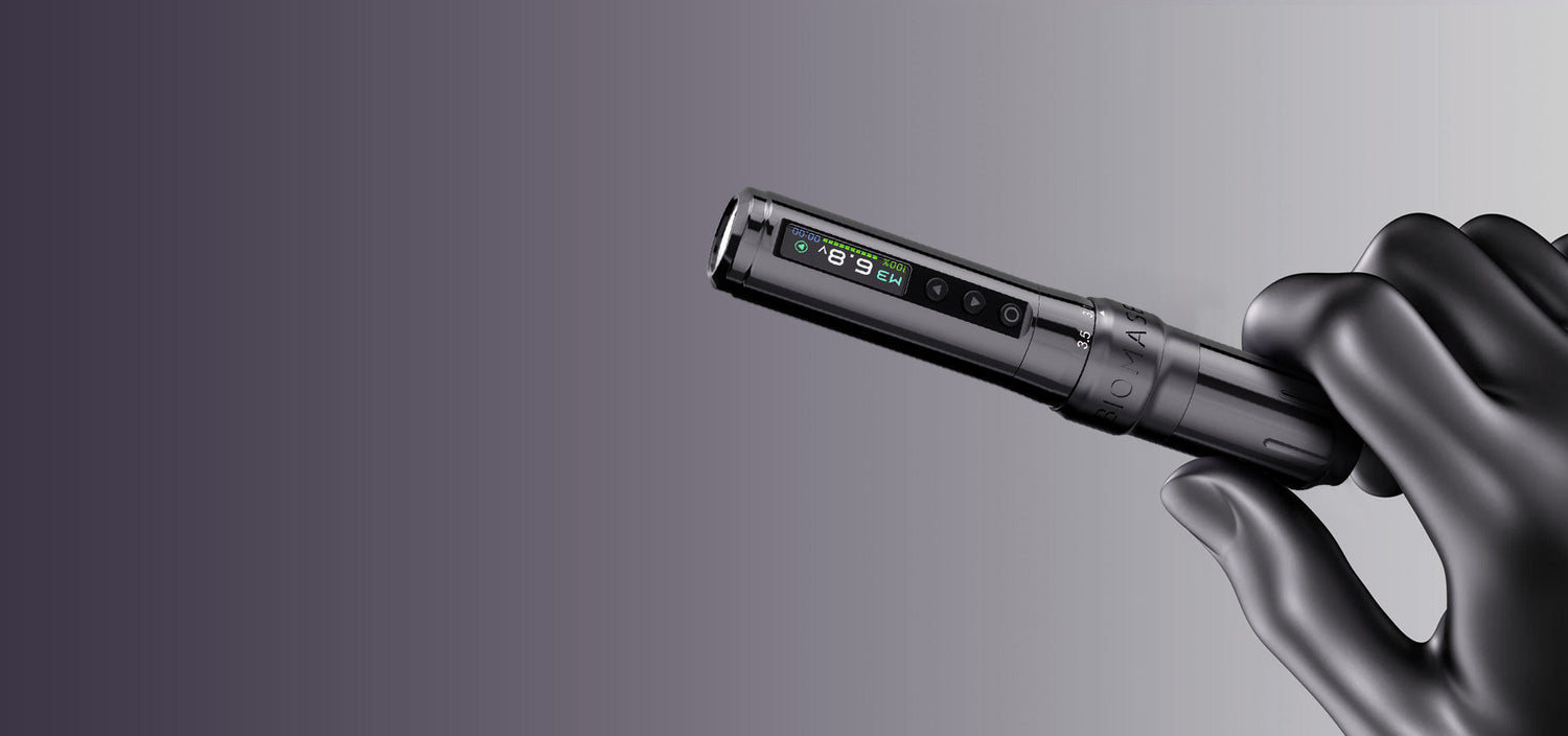 A tattoo artist's gloved hand holding a precision tattoo machine, essential for creating detailed small ear tattoo designs.