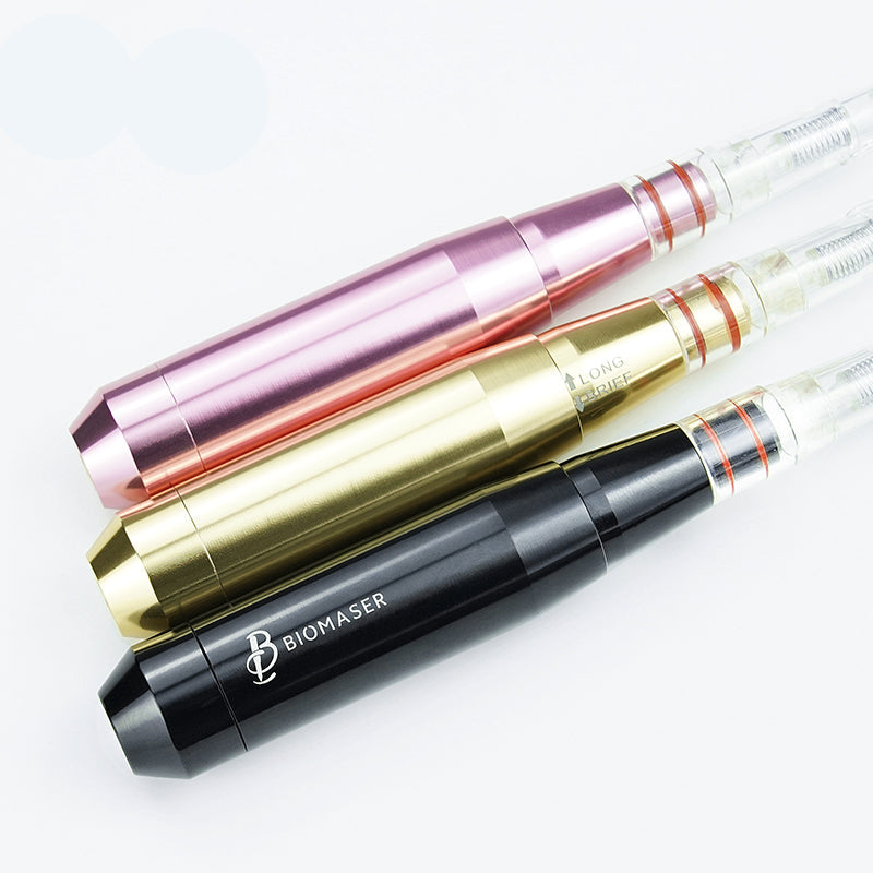 Biomaser PMU handpiece machines in black, gold, and rose gold. Professional tattoo equipment with cartridge needles.