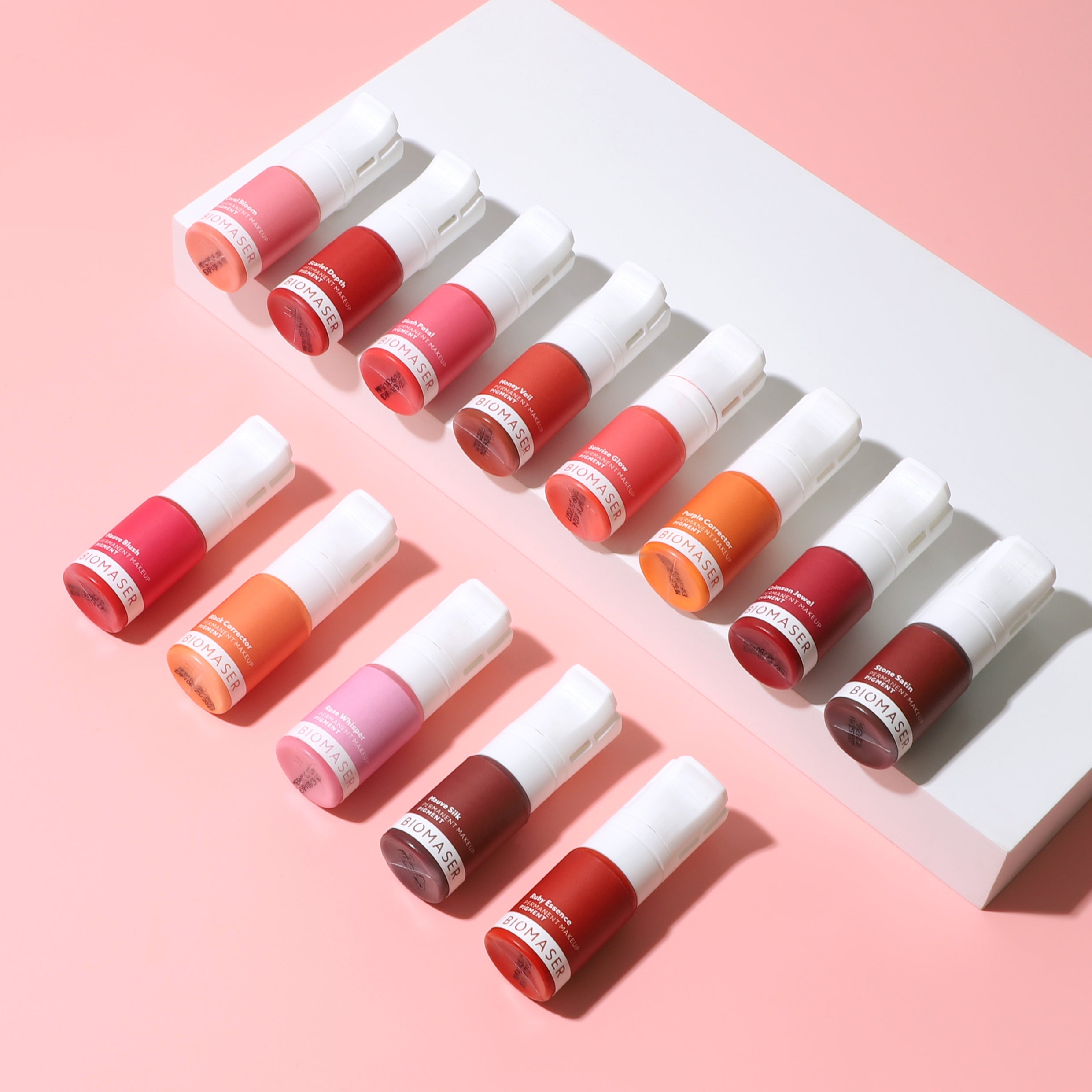Biomaser Powder PMU lip pigments in diverse colors: Coral Bloom, Scarlet Depth, Ruby Essence. Professional tattoo supplies.