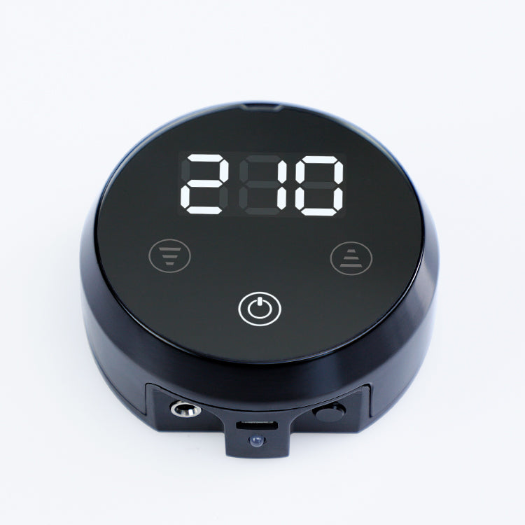 Black Biomaser P60 portable battery power supply with digital display for wireless PMU machine, displaying "210"