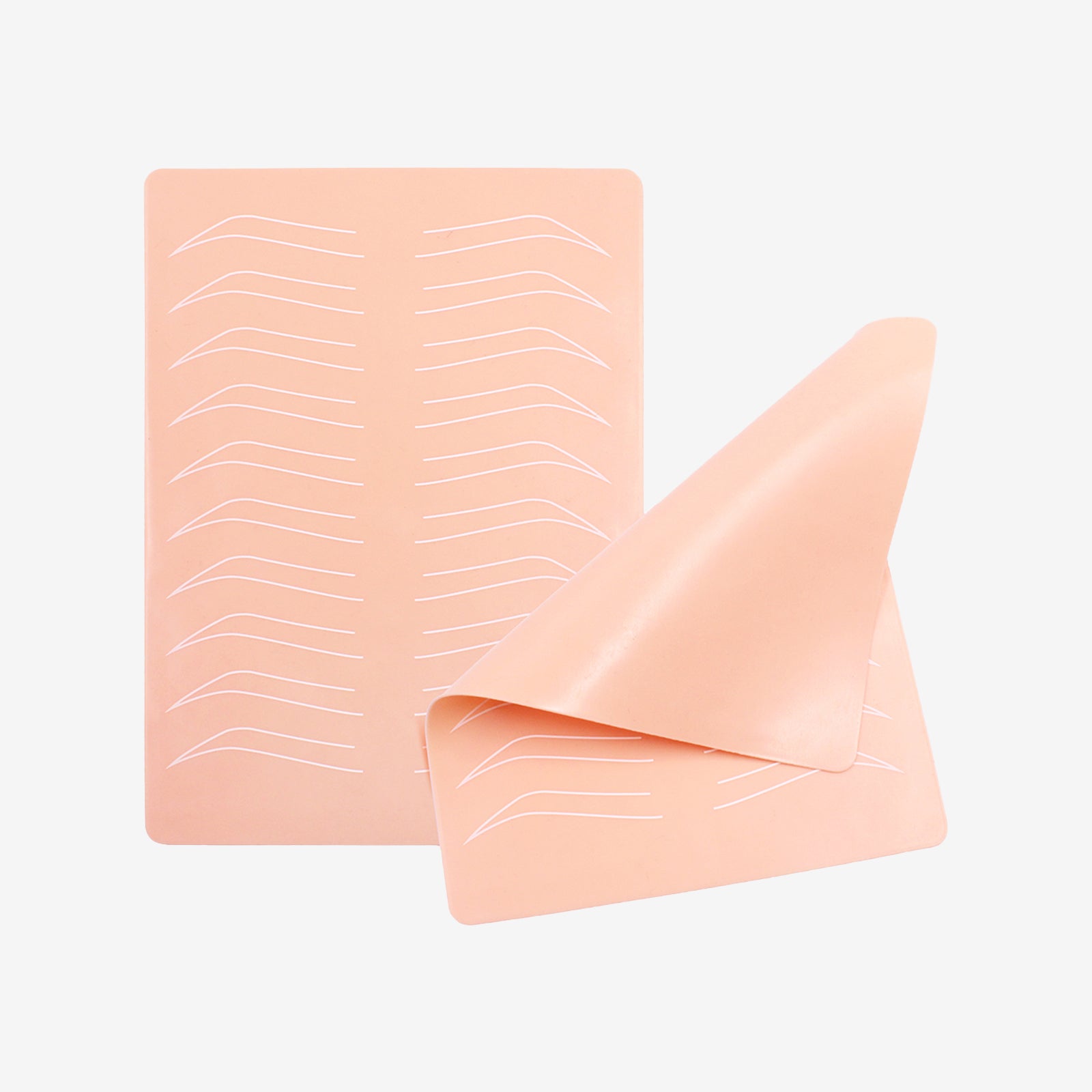 Silicone microblading practice skin with eyebrow outlines, for tattoo machine and microblading practice.