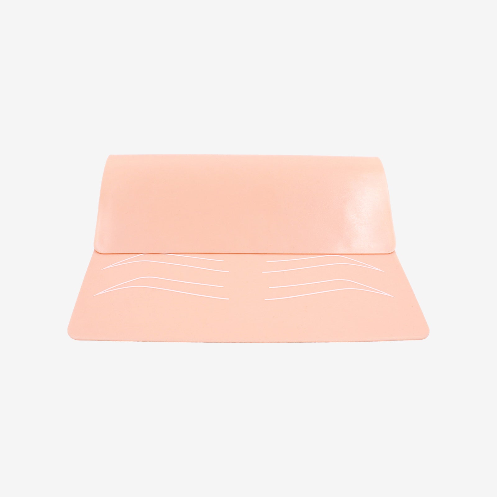 Peach silicone microblading practice skin with eyebrow outlines for tattoo machine practice. High quality practice tools.