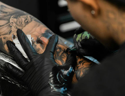 A Tattoo Worker doing Job