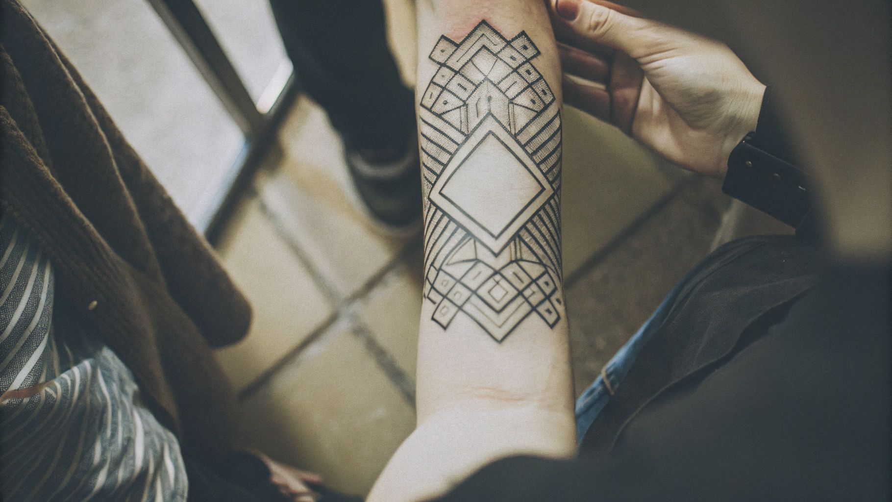 Close-up of a healed tattoo showcasing perfect, crisp single-pass black lines.